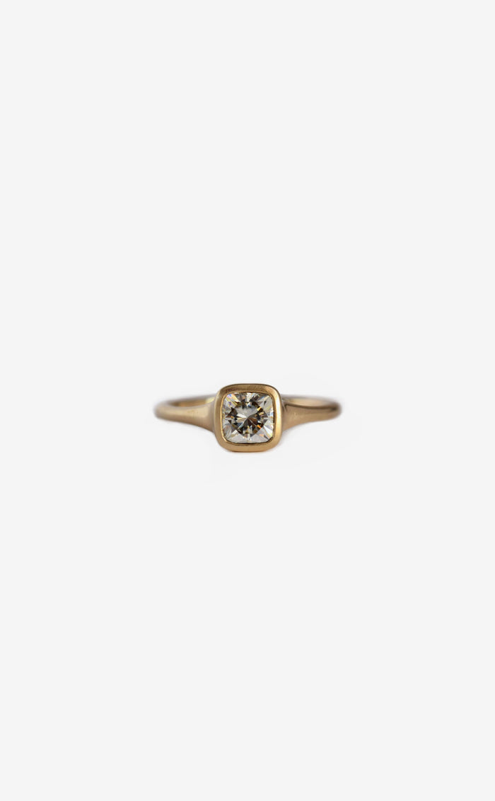 1 carat cushion diamond contour bezel ring in 18k gold
