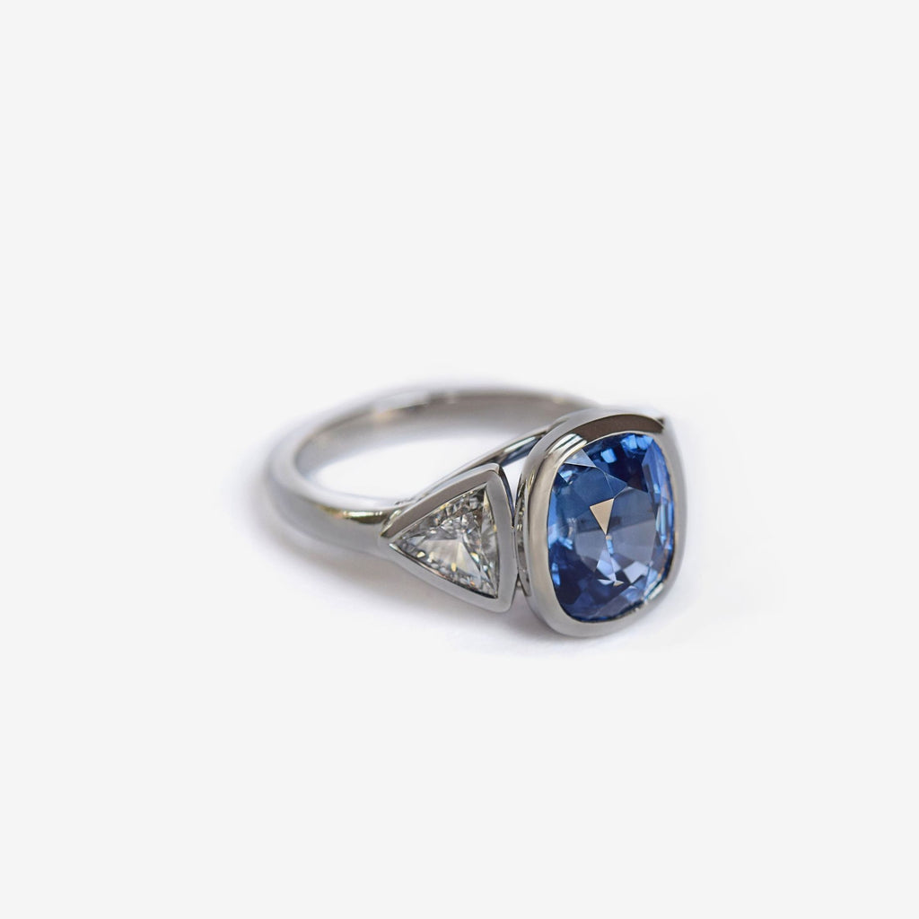 3 stone cushion cut natural blue sapphire ring with triangle diamond accents
